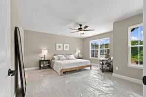 Primary bedroom with windows on two walls at Luna Ridge in Lenoir City, TN