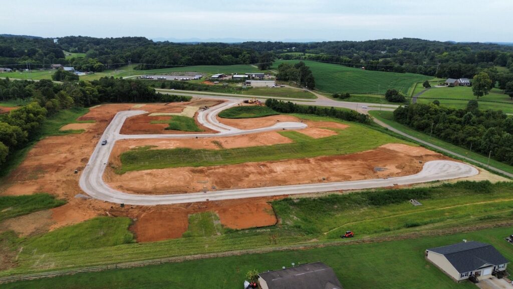 Aerial view of Cara Villa in Lenoir City, TN, with graded home sites and mountain views beyond