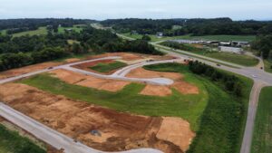 Aerial view of Cara Villa showing new streets and home sites alongside the highway in Lenoir City, TN